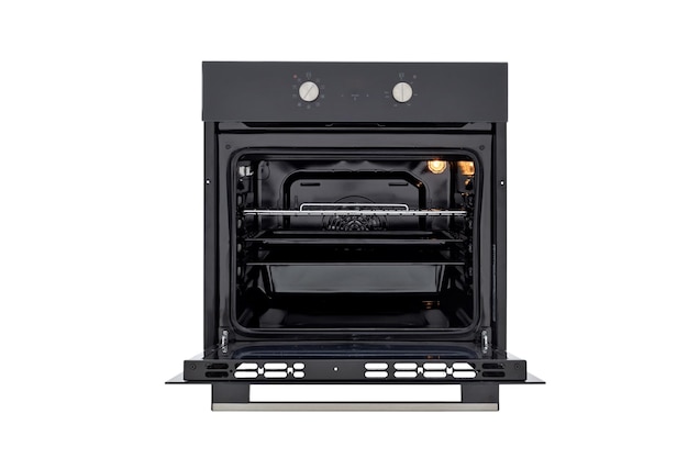 Black oven with open door and three trays with two control knobs