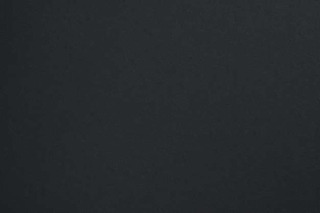 Photo black paper background black or dark gray paper texture