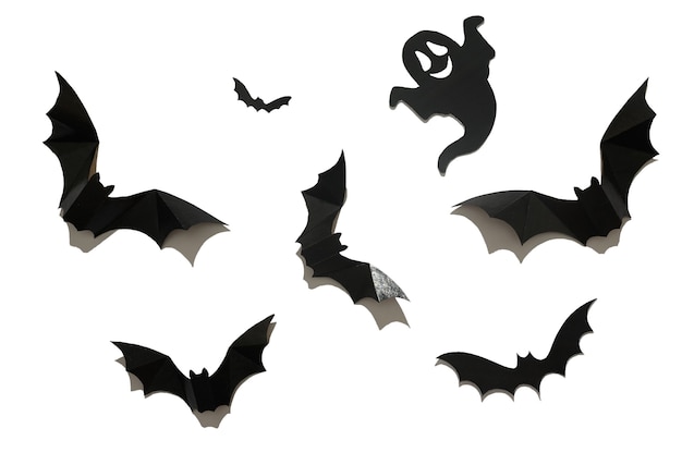 Black paper bat on a white background. Halloween concept.