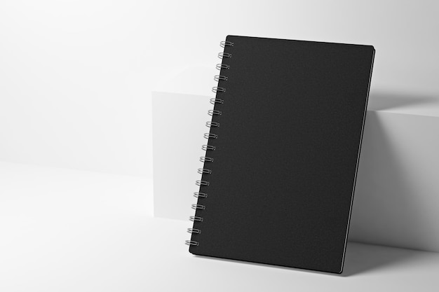 Premium Photo  Black paper notebook near the white box 3d rendering