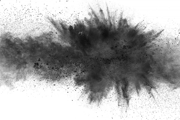 Black particles splatter on white background. Black powder dust burst.