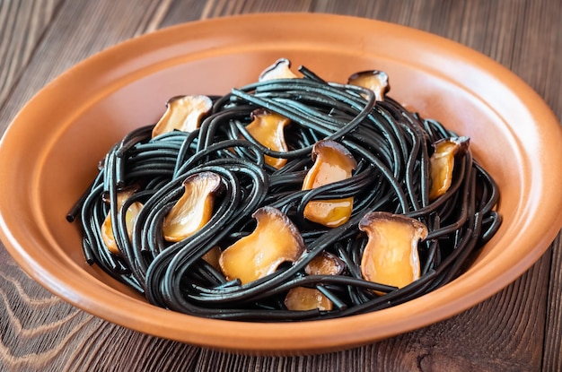 Black pasta with mushrooms