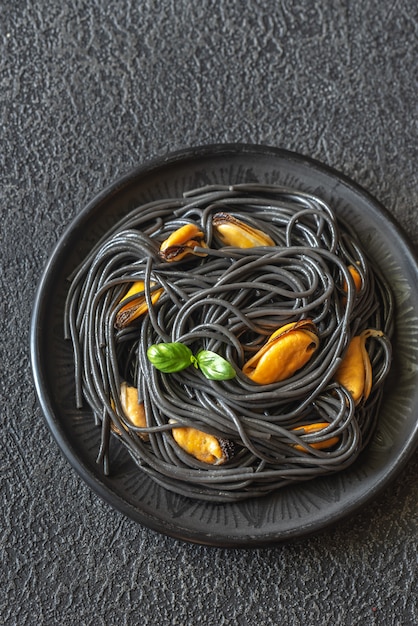 Black pasta with mussels and parmesan