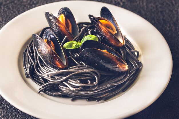 Black pasta with mussels