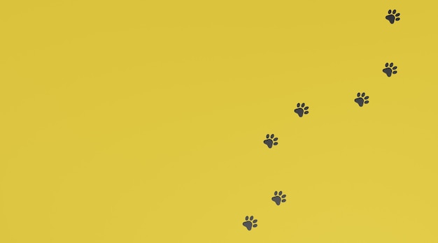 Photo black paw print on yellow background. dog or cat paw print