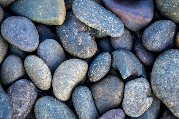 Black pebbles stone background 