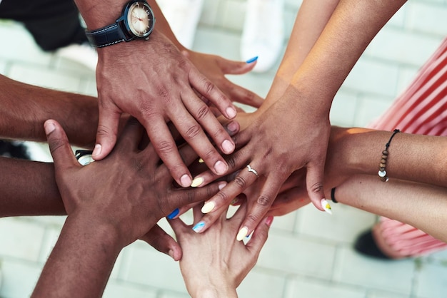 Photo black people with hands joined group of people stacking hands together