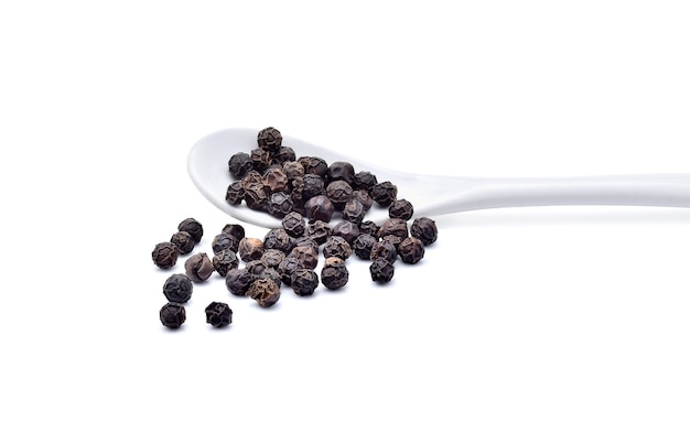 Black pepper corns isolated on white background