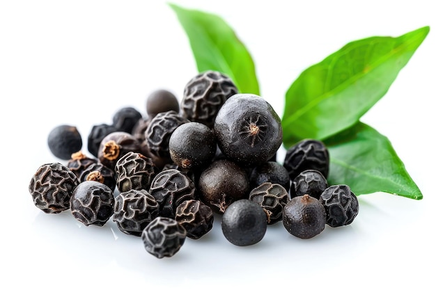 black peppercorns with leaves isolated on white background