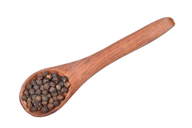 black peppercorns in wooden spoon isolated on white background