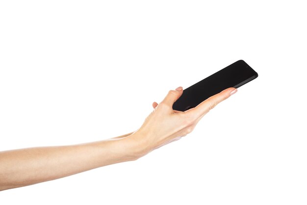 Black phone in female hand isolated on white background