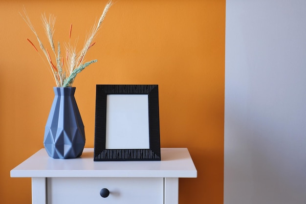 Black photo frame mockup in a living room