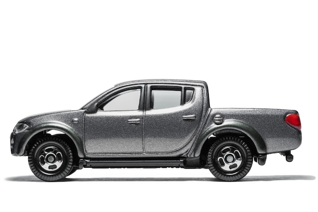 Photo black pickup truck toy  car on white background, black  model car isolated