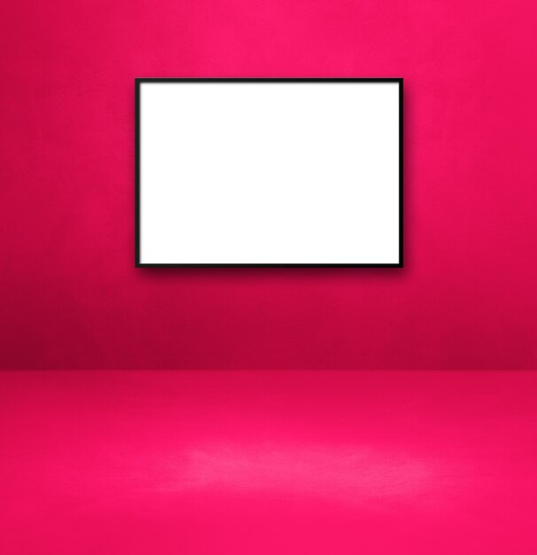 Black picture frame hanging on a pink wall. Blank mockup template