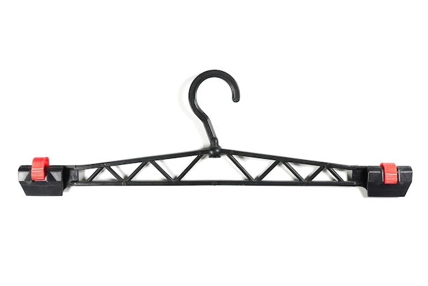 Black plastic clothes hanger on a white background Top view