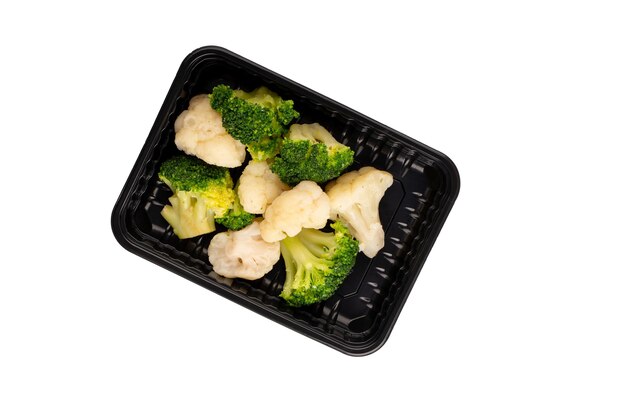 Black plastic container with cooked broccoli and cauliflower isolated on white background