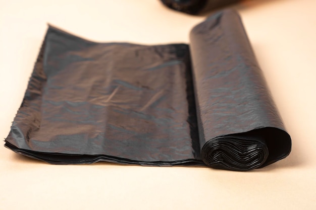 Black plastic trash bag closeup