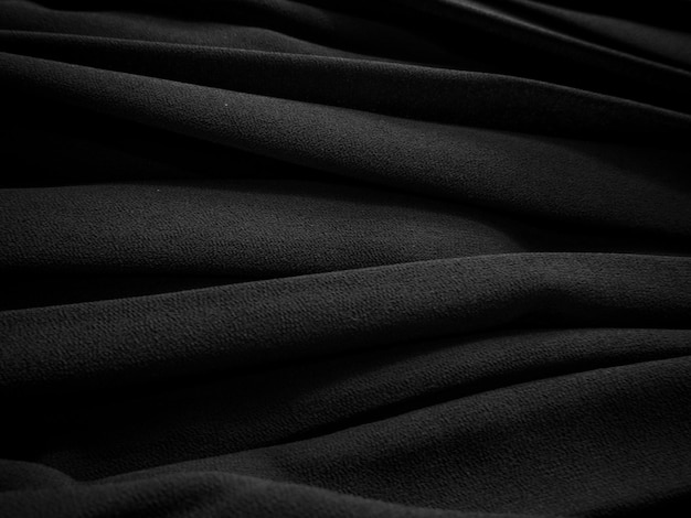 Black pleated fabric Dark clothes background