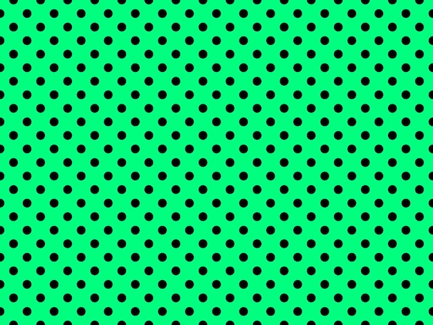 Photo black polka dots over spring green background