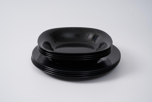 Black porcelain plates on a white background