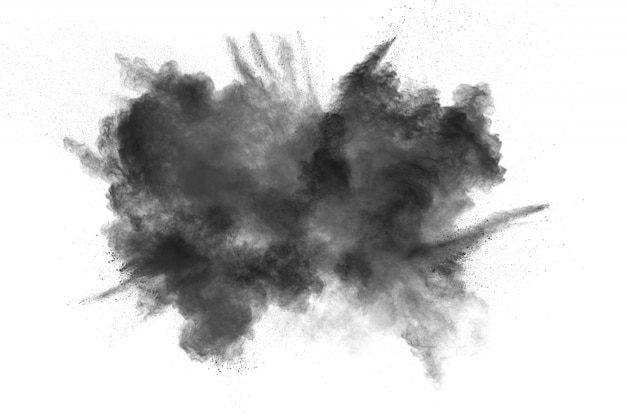 Black powder explosion on white background. Black dust particles splash.