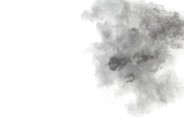 Black powder explosion on white background. Black dust particles splash.