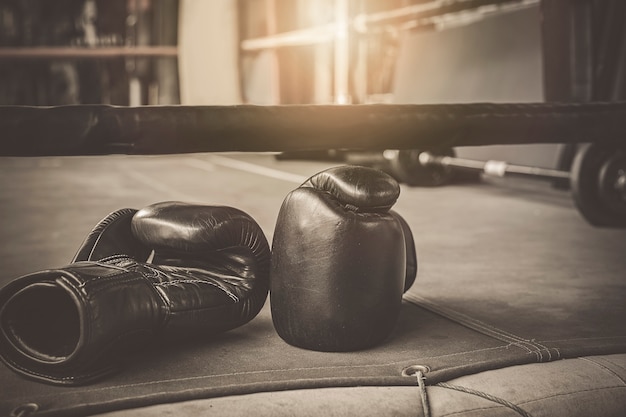 Black practise boxing gloves in the boxing gym