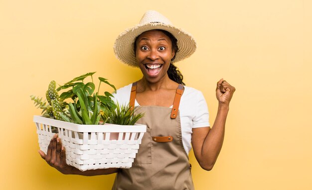 Black pretty woman feeling shockedlaughing and celebrating success