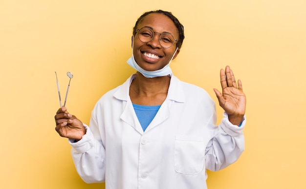 Black pretty woman smiling happily waving hand welcoming and greeting you