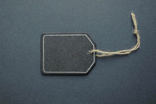 black price tag on the black background, black mockup