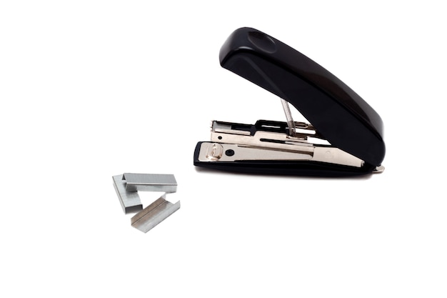 Black professional stapler with staples isolated on white background