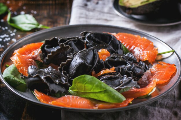 Black ravioli with salted salmon