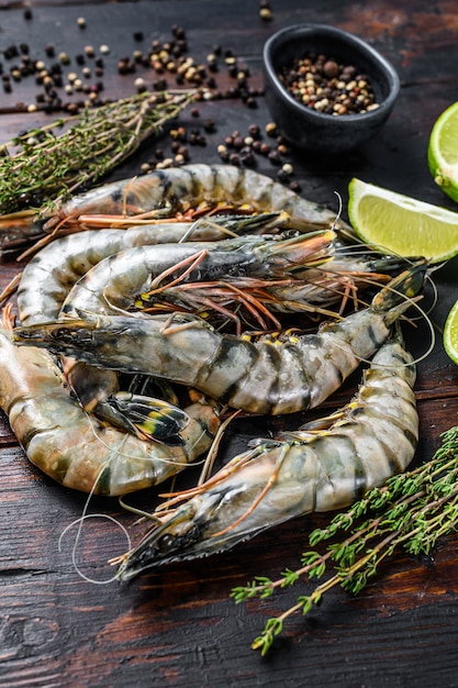 Black raw tiger prawns, shrimps with thyme and pepper