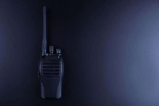 Black rectangle portable device with antenna isolated on black background radio transceiver set for communication radio set walkietalkie