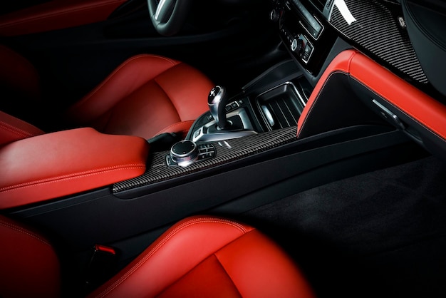 a black and red car with a red and black interior