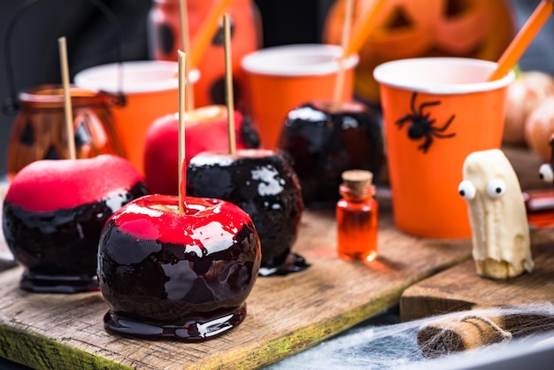 Black and red glazed apples for Halloween