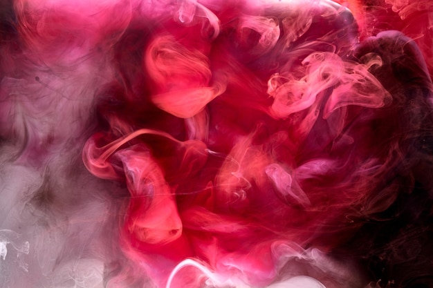 black and red ink background colorful fog abstract swirling ocean acrylic paint pigment underwater white smoke