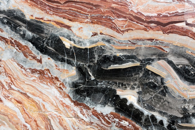 Black, red, whire, brown patterned natural marble texture. High resolution photo