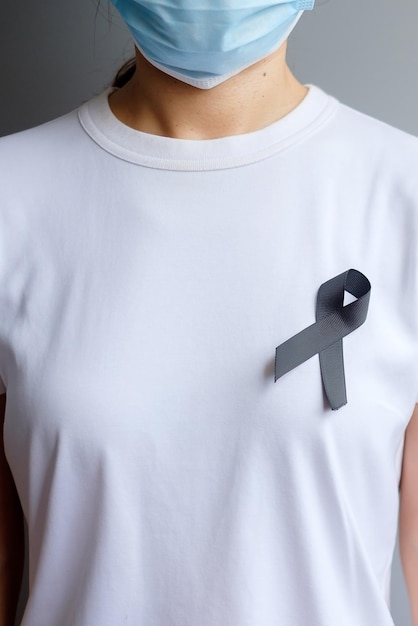 Black ribbon for melanoma and skin cancer vaccine injury\
awareness month grief and rest in peace healthcare and racist\
concept