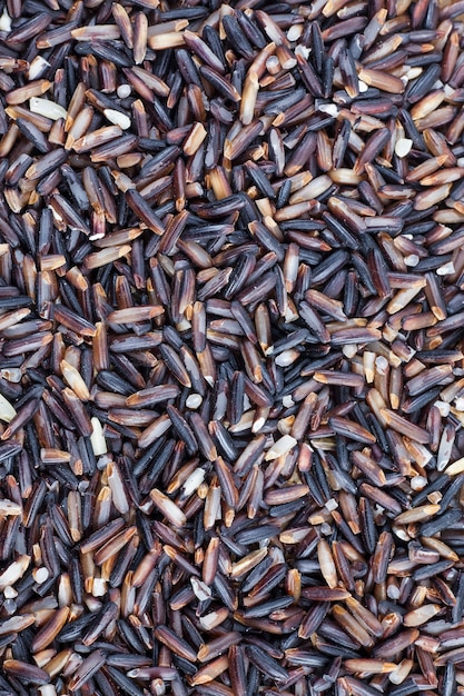 Black rice berries background.