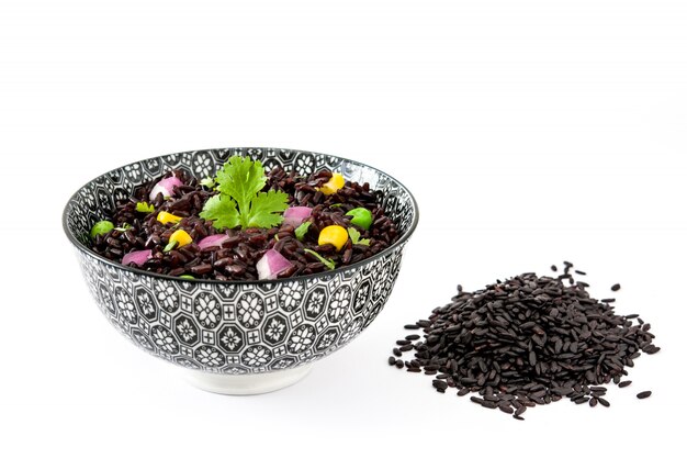 Black rice and vegetables isolated on white