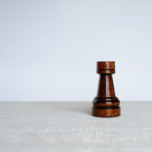 Black rook on a white table