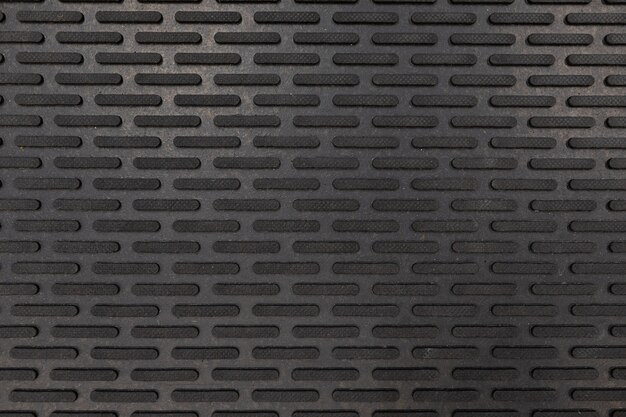 Black rubber floor mat close-up 