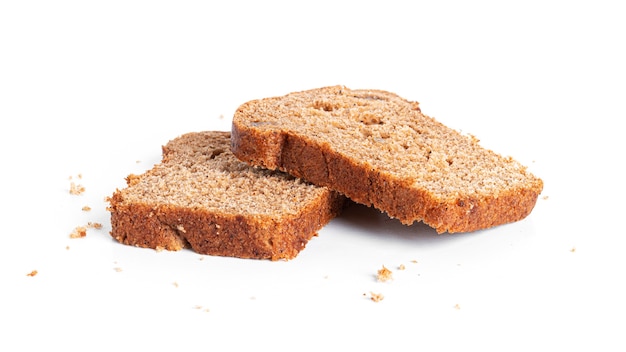 Black, rye bread with dried fruit on a white background. High quality photo