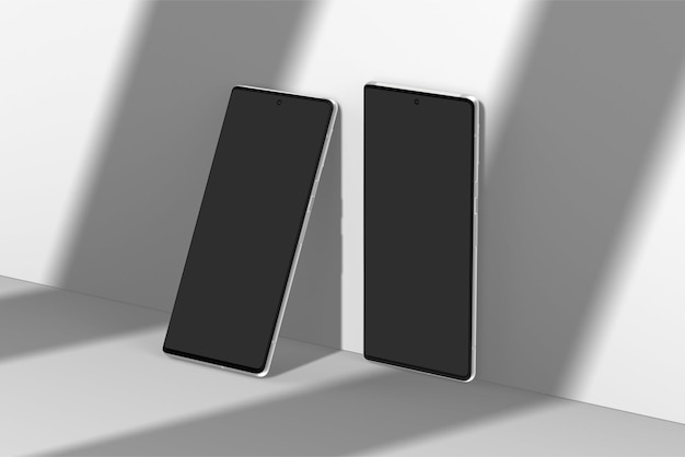 A black samsung phone sits on a white surface.