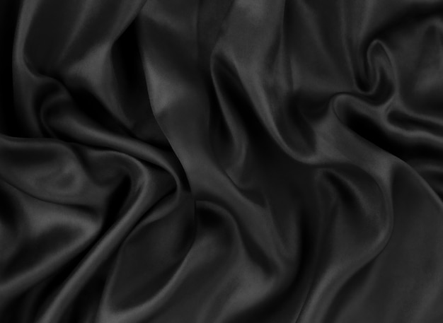 Photo black satin cloth with creases background