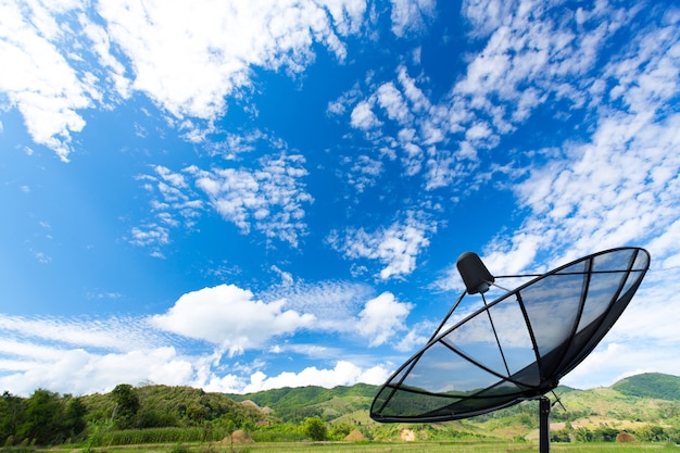 Black sattelite dish in the field