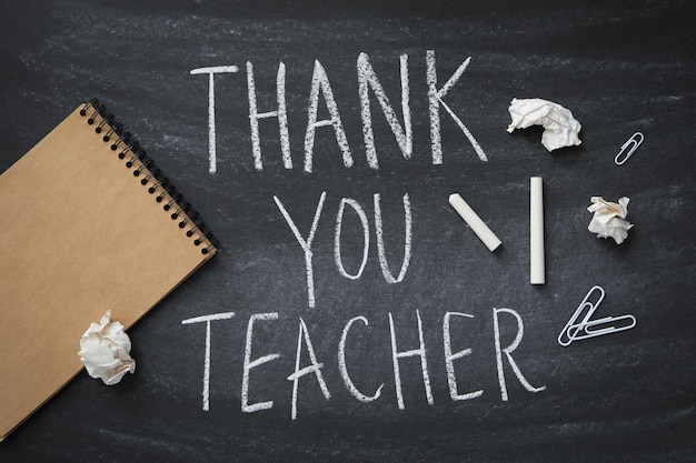 Photo black school board with chalk inscription thank you teacher