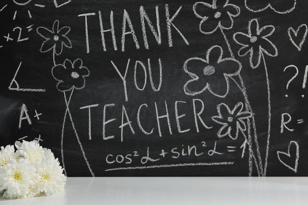 Black school board with chalk inscription Thank you teacher