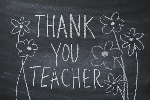 Photo black school board with chalk inscription thank you teacher